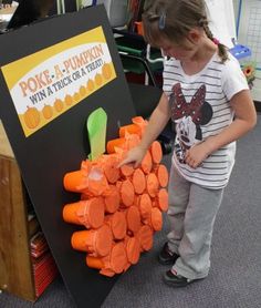 Poke a pumpkin. Filled with tricks AND treats :) we should do this for Fall Fest next year! or we could do it for Christmas in sunday school. make it like ornaments on a tree Poke A Pumpkin, Easy Halloween Games, Fun Halloween Party Games, Dekorasi Halloween, Fall Carnival, Kid Friendly Halloween, Skirt Diy, Halloween Games For Kids