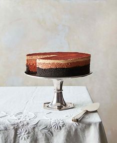 a cake sitting on top of a table next to a knife