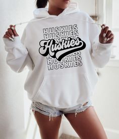 a woman wearing shorts and a hoodie with the word'houvy'printed on it