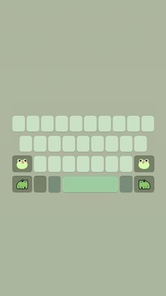 a computer keyboard with two green cats on it