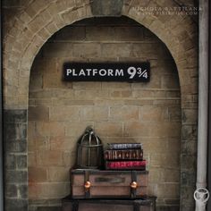 a brick wall with a sign that says platform 94