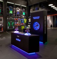 a display case in a sports store with neon lights