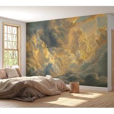 a bedroom with a large painting on the wall next to a bed in front of a window