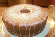 a bundt cake with icing on a glass plate