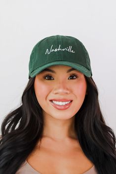 Calling all Nashville residents, the Nashville Script Embroidered Hat was made just for you! This cute hat is made of a soft cotton construction. It has a rounded top and a slightly rounded brim with "Nashville" embroidered on the front! Available in 3 colors. Adjustable Strap Embroidered 100% Cotton Spot Clean with Damp Cloth or Sponge One Size Fits Most Curved Bill Fitted Hat With Embroidered Logo, Cotton Embroidered Flat Bill Hat, Embroidered Logo Baseball Cap With Flat Brim, Embroidered Cotton Trucker Hat With Flat Bill, Curved Bill Hat With Embroidered Logo, Embroidered Logo Flat Brim Baseball Cap, Green Pre-shrunk Baseball Cap, Embroidered Cotton Fitted Hat With Curved Bill, Embroidered Cotton Fitted Hat With Curved Brim