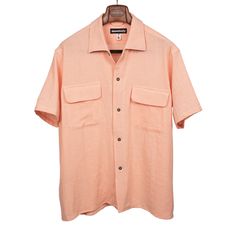 "A warm wind on vacation, a sunny stroll through the park, a relaxing beach day. These are just some of the situations this shirt is perfectly suited for. Deliberately channeling a midcentury Italian vibe, the slightly boxy fit and elegantly designed one piece camp collar allow the gauzy loose weave tropical fabric to shine. Allowing for superb air flow."---Kenshawn Details 100% cotton One piece camp collar, short sleeves, melamine buttons Two flapped chest pockets, back pleats Made in Los Angel Cheap Summer Camp Shirt With Button Closure, Classic Camp Shirt With Pockets, Luxury Cotton Camp Shirt For Men, Luxury Men's Shirt With Camp Collar, Luxury Collared Camp Shirt For Men, Luxury Men's Camp Shirt With Button Closure, Luxury Men's Camp Collar Shirt, Luxury Men's Relaxed Fit Camp Shirt, Relaxing Beach