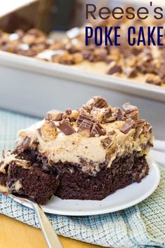 a piece of reese's poke cake on a white plate with a fork next to it