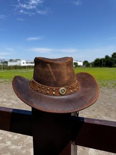 Certainly! Here's a revised description that includes shipping information: --- **Brown Cowboy Hat - Western Style Genuine Premium Cowhide Leather** Embrace the timeless charm of the West with our Brown Cowboy Hat, designed for both men and women. This unisex hat combines classic western style with top-notch craftsmanship, making it a versatile addition to any wardrobe. Features include: - **Genuine Premium Cowhide Leather Crafted from high-quality leather for durability, comfort, and a sophisti Cow Boy Hat, Cowboy Hut, Brown Cowboy Hat, Brown Fedora, Hat Western, Australian Style, Chapeau Cowboy, Western Cowboy Hats, Brown Cowhide