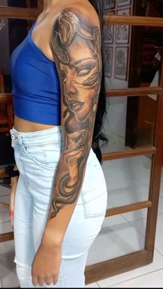 a woman with a tattoo on her arm