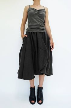 "🚚..ALL ORDERS ARE SHIPPED VIA DHL EXPRESS MAIL Treating every design as a piece of art, look no further than asymmetric midi skirt/pants. This special design skirt has one leg of pants. Asymmetric panelled construction. Wide elastic waistband. Tonal stitching. Asymmetric hem. * Pull-on style * 2\" elastic waistband * The skirt has one left leg of pants * Tonal stitching * Side seam pockets * Asymmetric hem * Unlined Measurements approximately: Waist: 26\" stretching to 46\" (66 cm-117 cm)-elas Chic Asymmetrical Cotton Bottoms, Cotton Asymmetrical Skirt With Pockets, Asymmetrical Cotton Bottoms For Fall, Avant-garde Asymmetrical Skirt For Spring, Chic Asymmetrical Skirt With Pockets, Fall Skirt With Pockets And Asymmetrical Hem, Baggy Pleated Skirt For Fall, Baggy Skirt For Fall, Baggy Fall Skirt