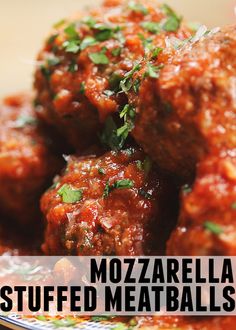 meatballs covered in sauce and parsley on a plate with the words mozzarella stuffed meatballs