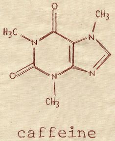 caffeine written in red ink on a piece of linen