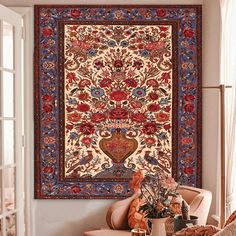 an ornate tapestry hanging on the wall in a living room