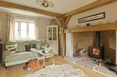 a living room filled with furniture and a fire place