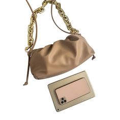 Carry me with you A super stylish piece to wear as a shoulder bag or clutch. The classy ruched clamshell opening and gold-tinted chunky rectangle chain links make this an elegant bag for many an occasion. Main Material: Faux (Vegan) PU Leather Lining Material: PU Hardware: Aluminum Alloy (frame); polyethylene plastic (strap) Number of Handles/Straps: One gold strap; one PU strap (removable) Interior: One Main Compartment Closure Type: Clamshell Size L H D cm 28 14 12 in 11 5.5 4.7 Note: As bag i Trendy Evening Clutch With Chain Strap, Trendy Shoulder Bag Clutch With Chain Strap, Trendy Evening Clutch With Chain, Trendy Gold Clutch With Chain, Trendy Chain Clutch Evening Bag, Trendy Clutch Evening Bag With Chain, Trendy Clutch Shoulder Bag With Gold Chain, Chic Gold Shoulder Bag With Chain, Trendy Everyday Evening Bag With Chain Strap