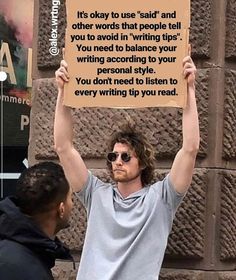 a man holding up a sign that reads it's okay to use said and other words that people tell you to avoid in writing your writing according to balance