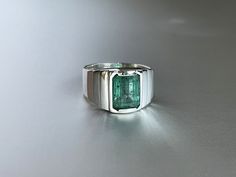 Natural Emerald men's sterling silver ring in handmade minimalist design. it's luxury promise or engagement ring for him. statement ring for men Main stone: Natural Untreated Emerald Cutting: emerald cut Weight: 2,79 ct Clarity: SL Quality, bright green color Detailed descriptions: rare clean and transparent stone, beautiful natural structure Treatment : No The 925 silver ring, was performed according to ancient Vedic traditions , stone spit finger. Unique author design. 100% handmade. Ring in a Engagement Ring For Him, Green Rings, Sterling Silver Mens, Green Gemstones, Natural Emerald, Emerald Ring, 925 Silver Rings, Promise Ring, Solitaire Ring