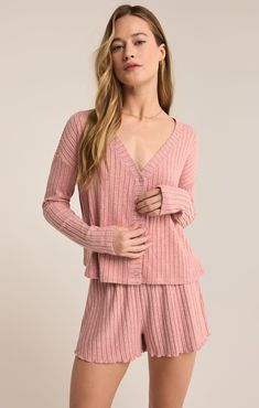 Slip into the effortless comfort of our relaxed fit cardigan top, made from silky rib fabric for a luxurious feel. This boxy, cropped piece features a V-neck, button front, and long sleeves, creating a casual yet chic look perfect for layering or wearing alone. Athleisure Tops, Silk Bottoms, Fitted Cardigan, Rib Fabric, Ribbed Shorts, Leather Denim, Ribbed Cardigan, Cardigan Top, Sleeve Cardigan