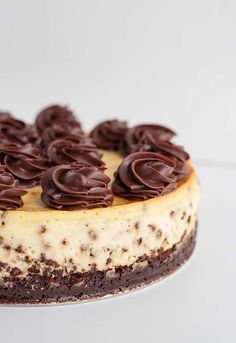 a cake with chocolate frosting and flowers on top