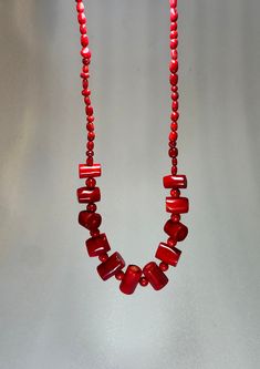 **Vintage Chunky Red Coral Necklace** Add a touch of timeless elegance to your collection with this Vintage Chunky Red Coral Necklace. This exquisite piece of vintage coral jewelry boasts bold, vibrant red beads that make a stunning statement. Perfect as a red statement necklace, it complements any outfit, whether casual or formal. Ideal for beach lovers, this necklace also serves as a thoughtful beach lover gift or a unique accessory for a beach wedding. Celebrate the natural beauty of coral and elevate your style with this one-of-a-kind treasure. Red Hand-strung Beaded Necklaces, Elegant Hand-strung Red Beaded Necklaces, Red Hand-strung Beaded Necklace, Elegant Red Hand-strung Beaded Necklaces, Vintage Red Coral Round Bead Jewelry, Vintage Single Strand Red Coral Beaded Necklaces, Vintage Red Coral Single Strand Beaded Necklace, Vintage Single Strand Red Coral Beaded Necklace, Vintage Style Jewelry With Single Strand Red Coral