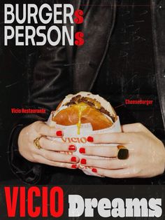 a woman holding a burger in her hands with the words vicio dreams written on it