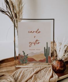 a card with the words candy and gifts on it next to a potted plant