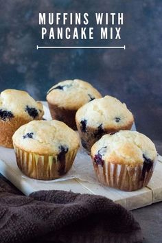 muffins with pancake mix on a cutting board next to a brown towel