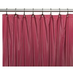 a red shower curtain hanging on a metal rod