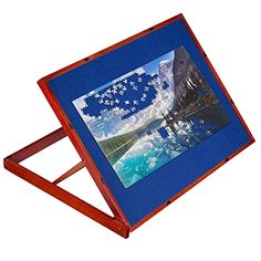 a wooden frame with a painting on the front and back sides, holding a puzzle piece