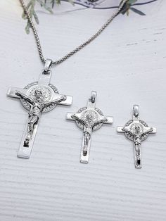 This Spiritual Crucifix of Saint Benedict Double Sided made from high quality sterling silver 925 its the perfect gift for anyone and excellent for everyday wear. Cubic Zirconia Crucifix size :5.5cm×3cm(with a hook) Crucifix size :3.5cm×2cm (with a hook) Crucifix size :3cm×1.80cm (with a hook) Chain length : 45cm or 40 cm Silver Tarnish-resistant Cross Pendant Jewelry, Nickel-free White Gold Cross Pendant Jewelry, Silver Cross Pendant With Sterling Silver Clasp, Silver Sterling Silver Crucifix Necklace, Nickel-free Sterling Silver Crucifix Necklace, White Gold Sterling Silver Crucifix, Sterling Silver Crucifix Jewelry As Gift, Personalized Silver Crucifix Jewelry, Silver Crucifix Necklace For Anniversary