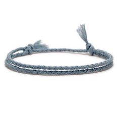 a blue rope bracelet with white thread