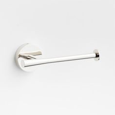 a white toilet paper holder with a metal bar on the front and back of it