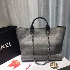 Description CC Deauville Tote Tweed Canvas Bag Fall/Winter Collection, Light Grey/ Dark Grey For Women 15in/38 cm Rep 1:1 Measurements: 38 x 30 x 18 cm / 15 x 11.5 x 7 inches (Length x Width x Height) Chain Light Grey/ Dark Grey Gold-toned hardware Include dust bag. This product is of the best quality. Baby Tote Bag, Vanity Bag, Mini Bucket Bags, Fall Winter Collection, Stylish Handbags, Luxury Products, Chanel Bags, Evening Clutch Bag, Grey And Gold