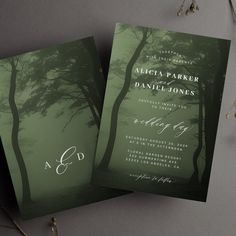 two green wedding cards with trees on the front and back, sitting next to each other