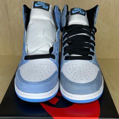 Air Jordan 1 Retro High Og 'University Blue' The Air Jordan 1 Retro High Og ‘University Blue’ Makes Use Of A Familiar Palette That Gives The Nod To Michael Jordan’s Unc Alma Mater. The All-Leather Upper Features A White Base With Powder Blue Overlays And A Black Signature Swoosh. Matching Black Accents Make Their Way To The Collar, Tongue Tag And Printed Wings Logo On The Lateral Collar Flap. A Brighter Shade Of Blue Is Applied To The Standard Aj1 Outsole, Featuring Multi-Directional Traction An Light Blue Jordan Shoes With Round Toe For Streetwear, Light Blue Custom Sneakers With Cushioned Footbed For Streetwear, Nike Custom Sneakers With Boost Midsole In Light Blue, Nike Blue High-top Sneakers With Laces, Nike Jordan 1 University Blue, Blue High-top Jordan Shoes With Air Max Cushioning, Light Blue High-top Jordan Shoes With Branded Insole, Custom High-top Light Blue Sneakers With Cushioned Footbed, Air Jordans University Blue