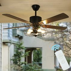 a ceiling fan that is connected to an appliance in front of a house