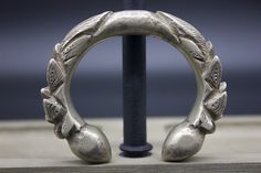 A pair of medium size solid silver Alloy bracelets. These are also called Bunge Bala. It has a thorn-like carving at each end and round polished finials. These are worn by women of various tribal groups for centuries. wt: 264g diameter: 5cm circumference: 13cm origin: Nepal Silver Carved Bracelet For Ceremonial, Antique Silver Hand-cast Bracelets, Antique Silver Hand Cast Bracelets, Ornate Silver Bracelet With Antique Finish, Copper Dragon, Dragon Bracelet, Tibetan Singing Bowls, Metal Bracelets, White Metal