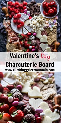 valentine's day charcuterie board with strawberries and chocolates on it