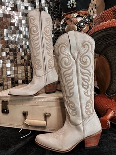 Embrace effortless Western elegance with these breathtaking boots. Crafted from buttery-soft suede in a dreamy, cloud taupe hue, they feature exquisite Western embroidery that adds a touch of authentic charm to the smooth, supple surface. The classic cowboy boot silhouette, with its pointed toe and stacked heel, provides both style and comfort. Perfect for dressing up or down, these versatile boots will become a go-to in your footwear collection. Express your awesome Western-inspired fashionista Chic Leather Boots For Western-themed Events, Beige Suede Snip Toe Boots, Elegant Snip Toe Boots For Western-themed Events, Western Beige Leather Heeled Boots, Beige Leather Western Heeled Boots, Western Cream Ankle Boots, Western Beige Snip Toe Boots, Western Style Cream Ankle Boots, Beige Western Snip Toe Boots