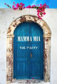 a blue door with the words mamma mia on it and flowers growing out of it