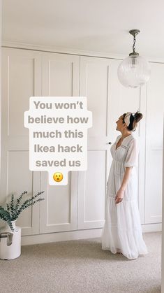 a woman standing in front of a white wall with a message above her that reads, you won't believe how much this ikea hack saved us