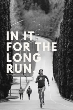 a woman running down a road with the words in it for the long run