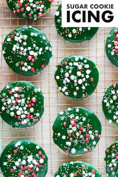 green frosted sugar cookies with sprinkles on a cooling rack for icing