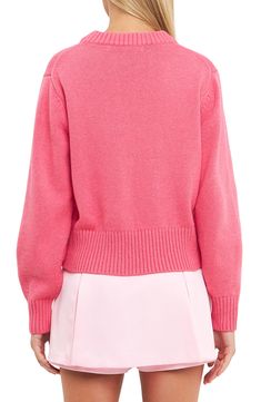 A relaxed, slightly oversized fit adds to the cozy vibes of this playfully pink cotton-blend sweater knit with ribbed trim. Crewneck Long sleeves Ribbed cuffs and hem 50% cotton, 30% acrylic, 20% wool Hand wash, dry flat Imported Fall Pink Sweater With Ribbed Cuffs, Pink Fall Sweater With Ribbed Cuffs, Pink Sweatshirt With Ribbed Collar For Spring, Cozy Pink Sweater With Ribbed Cuffs, Spring Pink Cardigan With Ribbed Cuffs, Pink Sweater With Ribbed Cuffs For Loungewear, Pink Crew Neck Cropped Sweater With Ribbed Cuffs, Pink Cropped Crew Neck Sweater With Ribbed Cuffs, Spring Cropped Sweater With Ribbed Collar And Relaxed Fit