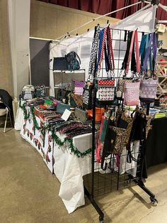 a table with many items on it and some red, white, and blue ribbons hanging from the ceiling