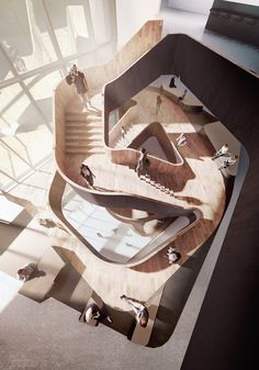 an aerial view of a skateboard ramp in a building with lots of glass and wood