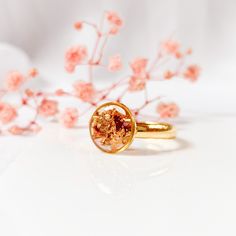 Handcrafted ring with real fall leaves and leaf gold in resin. DETAILS ------------ You get a ring with real dried forest leaves and leaf gold, preserved in crystal clear resin. The ring is ajustable and out of stainless steel. All materials are skin-friendly and suitable for allergy sufferers. These are natural flowers, therefore the shape, size and color of your flower may vary slightly. I press all flowers myself and by hand and will do my best to use only flowers that look as similar as poss Gold Rings With Pressed Flowers For Wedding, Handmade Rose Gold Rings For Gifts, Gold Ring With Pressed Flowers, Handmade Gold Rings As Gift For Her, Minimalist Gold Rings As A Gift For Her, Rose Gold Birth Flower Rings As Gift, Rose Gold Birth Flower Rings For Gifts, Gold Promise Rings With Natural Inclusions, Forest Ring