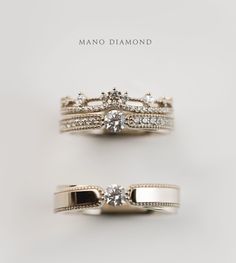 two wedding rings with diamonds on each one and the words mano diamond written in white gold