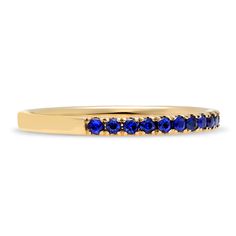 Loved for its barely there, stackable design and versatility, our Thread Ring is the most perfect choice for the modern woman. Brilliant sapphires are hand set in elegantly sculpted prongs that extend three quarters around the finger. For the minimalist, we love it as an everyday essential that can be worn on its own for an elegant and understated appearance. For those who fancy a more elaborate look, stack together multiples for a more significant statement. It can also serve as a beautiful com Elegant Yellow Gold Sapphire Eternity Band, Elegant Sapphire Stackable Rings With Prong Setting, Elegant Sapphire Stackable Eternity Band, Modern 14k Gold Stackable Rings With Prong Setting, Modern Stackable Rings With Prong Setting, Timeless Stackable 14k Gold Sapphire Ring, Fine Jewelry Sapphire Stackable Rings For Formal Events, Fine Jewelry Sapphire Stackable Rings For Formal Occasions, Classic Stackable Sapphire Ring With Round Band