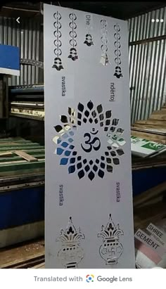 a sign with stickers on it in front of some metal sheets and other items